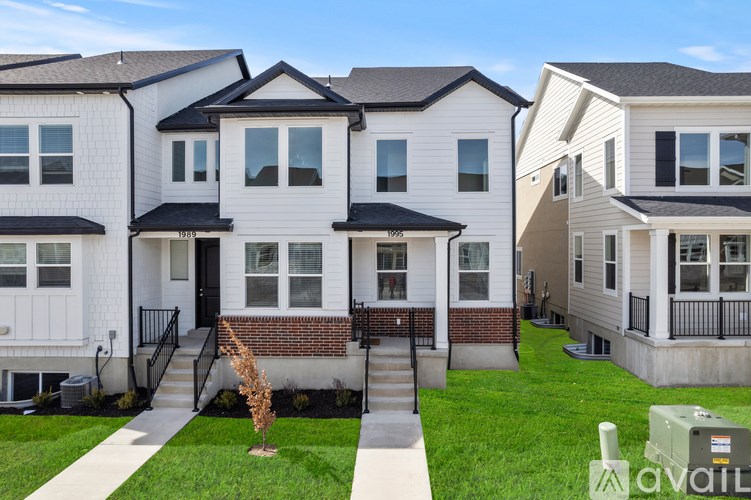 A row of houses with a sign that says "available" in front of the first one.