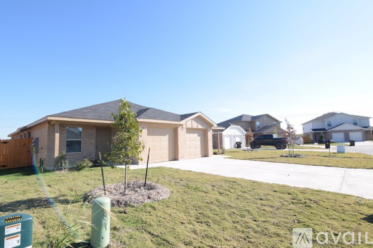 A row of houses with a sign in front of them.