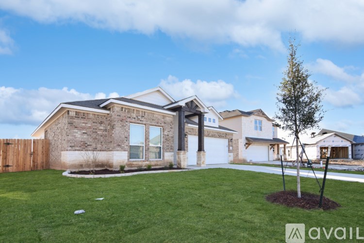 A house with a garage is available for sale.