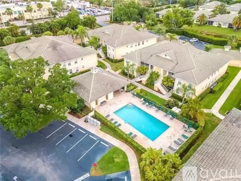 A large house with a pool in the front yard.