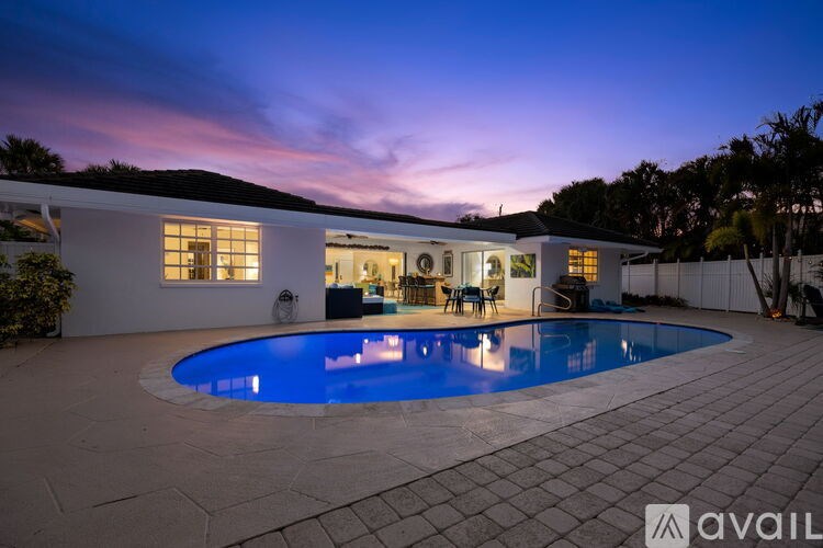 A house with a pool in the backyard.