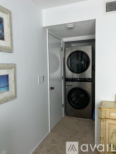 A small room with a washer and dryer in it.