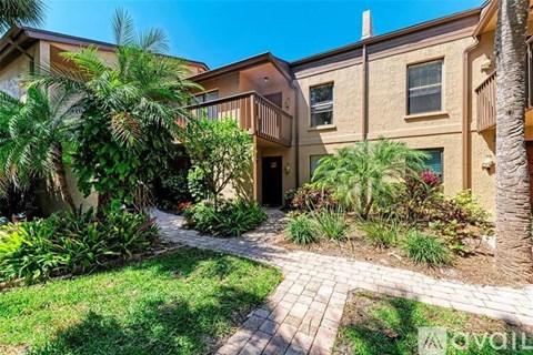 A building with a garden in front of it.