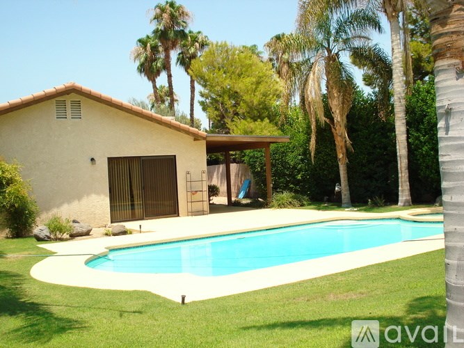 A house with a pool in the backyard.