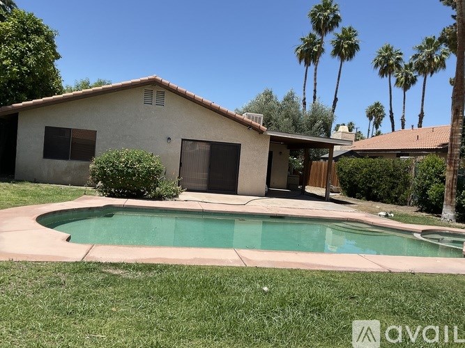A house with a pool in the backyard.