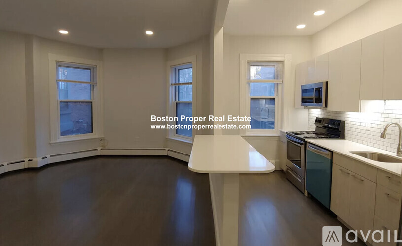 A kitchen with a countertop and cabinets is available for rent.
