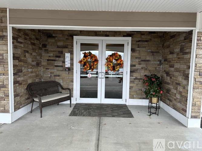 A glass door with a wreath on it.