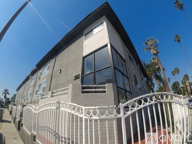 A grey building with the number 301 on it.