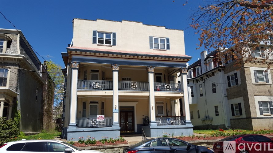 A two-story house with a balcony is for sale.