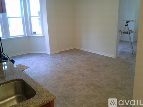 A kitchen with a sink and a window.