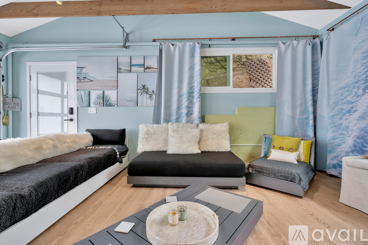 A living room with a grey sofa and a coffee table.
