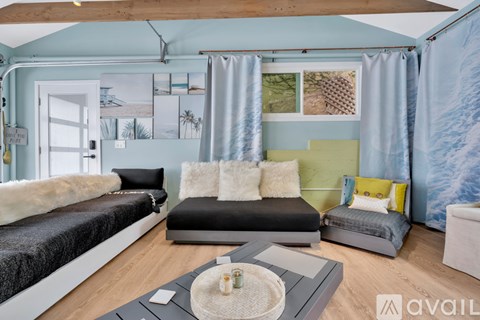 A living room with a grey sofa and a coffee table.