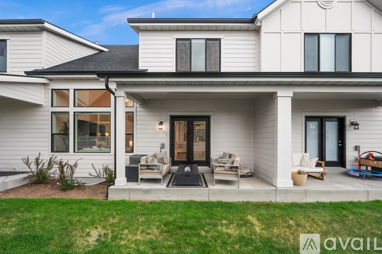 A modern house with a front porch and a covered entrance.
