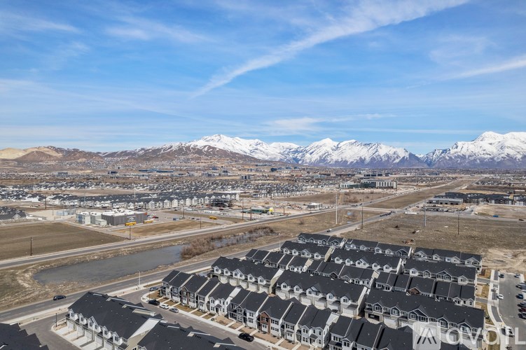 A housing development with a mountain range in the background.