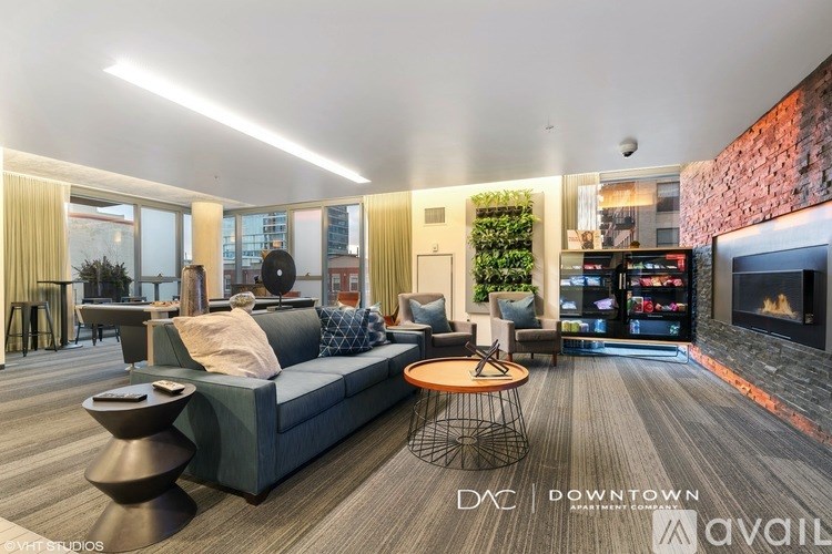 A modern living room with a fireplace and a TV on the wall.
