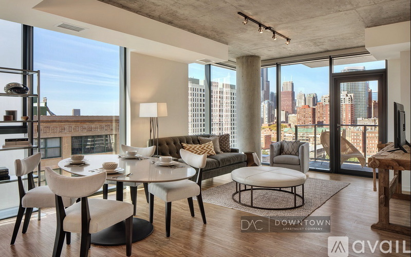 A modern living room with a view of the city skyline.