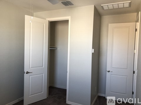 A room with two doors, one of which is open.