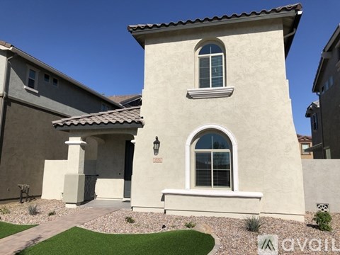 A beige house with a window and a door.
