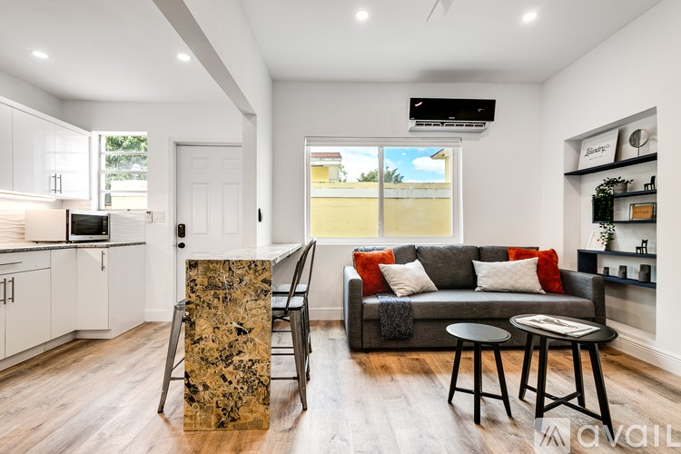 A modern living room with a couch, chair, and coffee table.