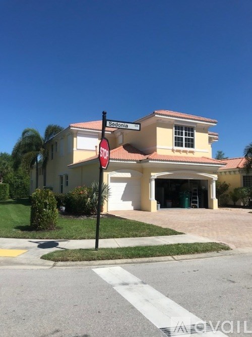 A house with a red stop sign in front of it.