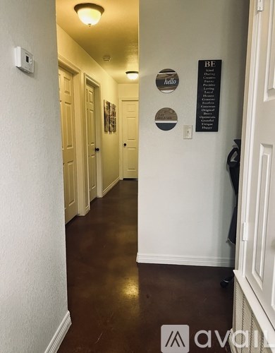 A hallway with a sign that says "hello" on the wall.
