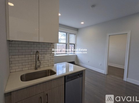 A kitchen with a sink and a window.