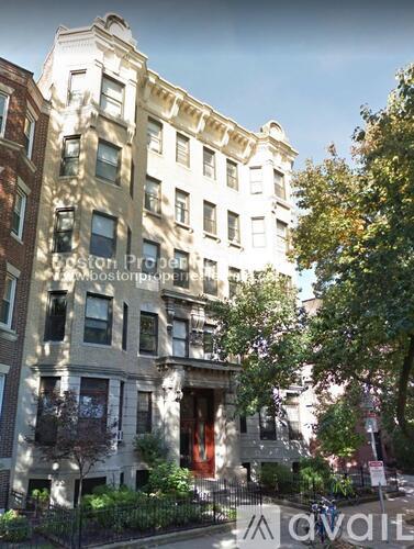 A street view of a building with the sign "Avail" on the front.