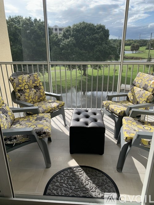 A patio with a table, chairs and a bench.