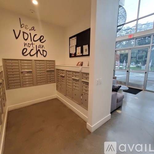 A wall with the words "be a voice not an echo" written on it.