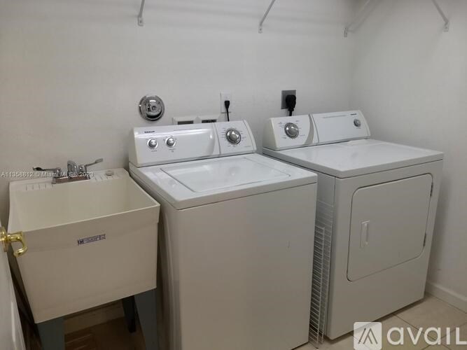 A white dryer and washer are available for rent.