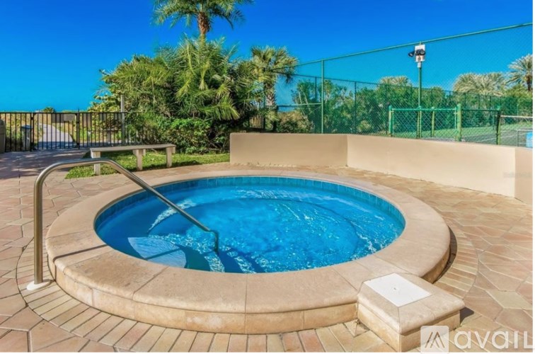 A small round pool with a metal ladder.