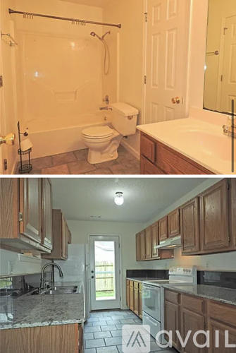 A bathroom with a toilet, sink, and shower.