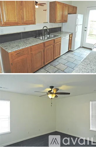 A kitchen with wooden cabinets and a white fridge.