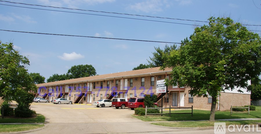 A building with a sign that says "available" in front of it.