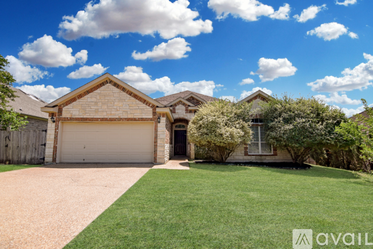 A house with a driveway and a garage.