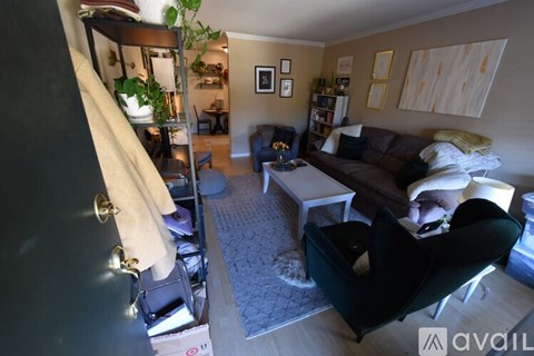 A living room with a couch, chair, and a coffee table.