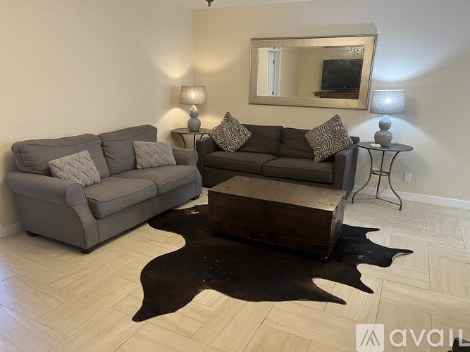 A living room with two couches and a coffee table.