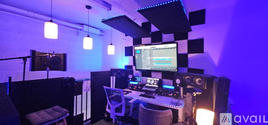 A room with a computer and sound equipment.