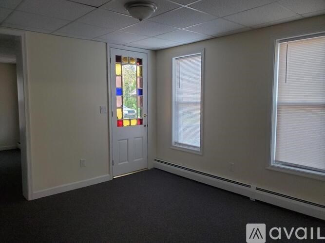 A room with a door and a window.