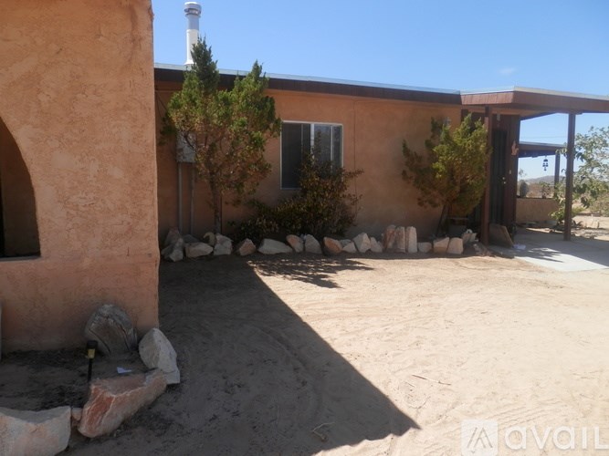 A house with a brown exterior and a white chimney.