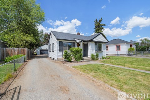 A house with a driveway in front of it.