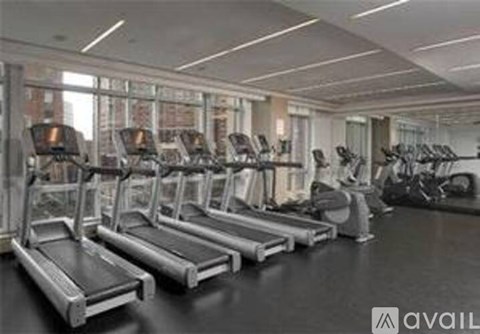 A gym with treadmills and exercise bikes.