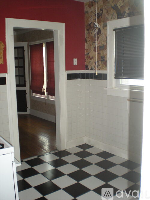 A room with a black and white checkered floor.