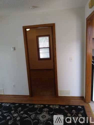 A room with a door and a window.