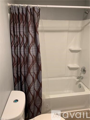 A long hallway with doors on both sides.