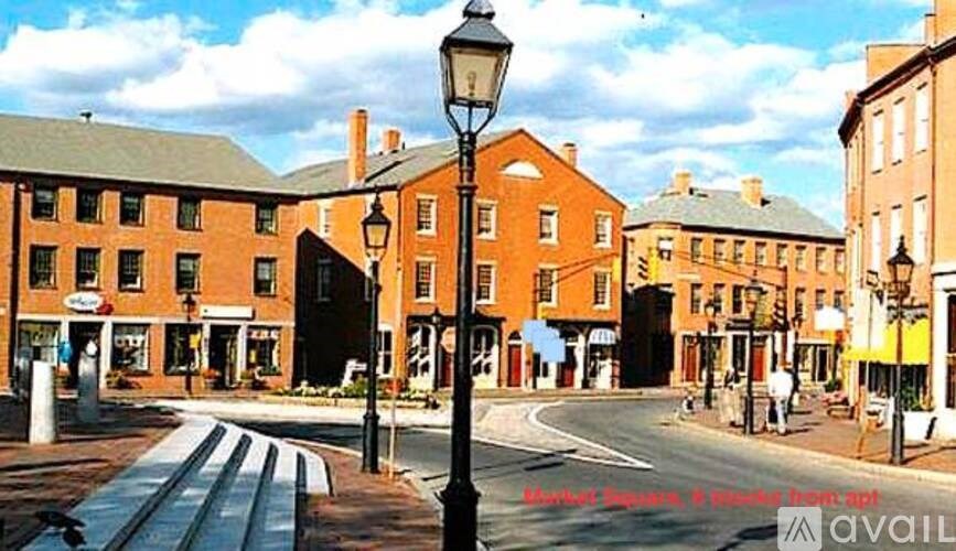 A street view of a town with buildings and a street light.