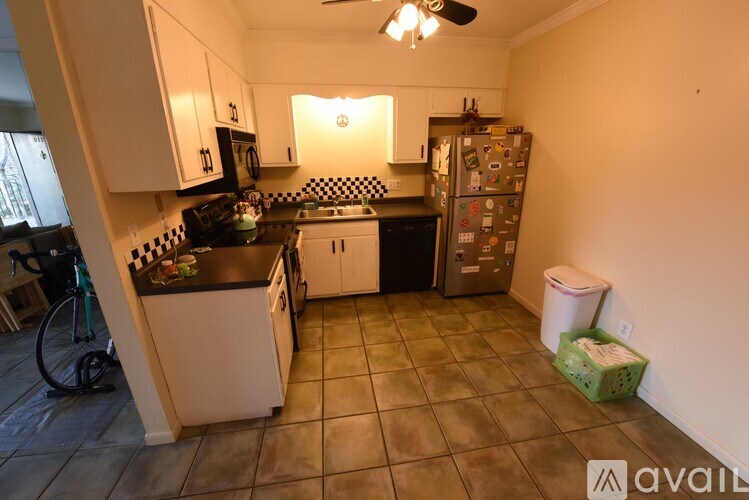 A kitchen with a black and white checkered backsplash.