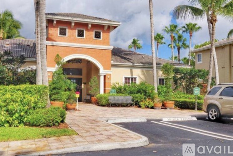 A house with a car parked in front of it.