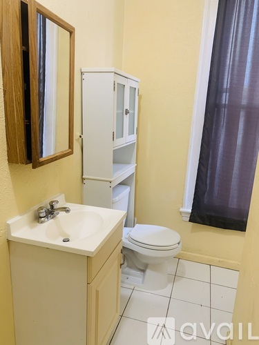 A room with wooden floors and a window.