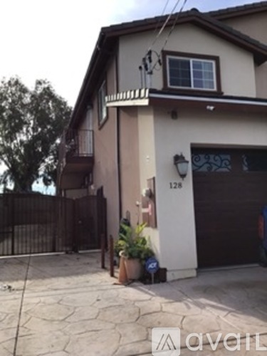 A house with a garage door that says 126.